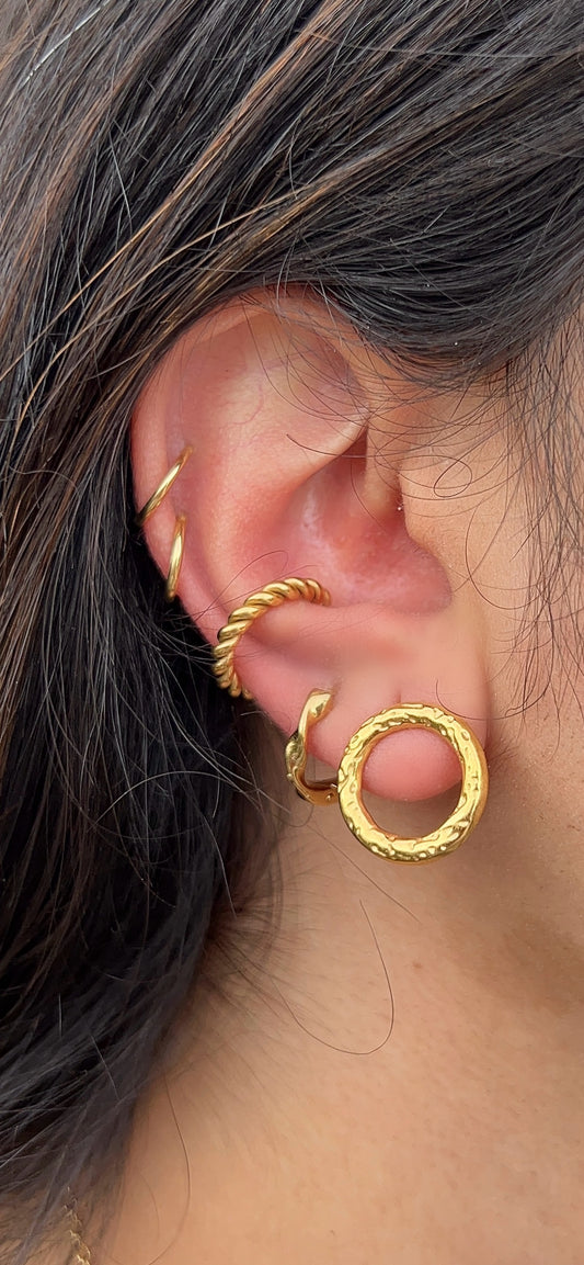 Twisted Ear CuffThe Coeur Earrings are a charming and romantic accessory that captures the essence of love and affection. These earrings feature a design inspired by the shape of a Stainless SteelTwisted Ear Cuff