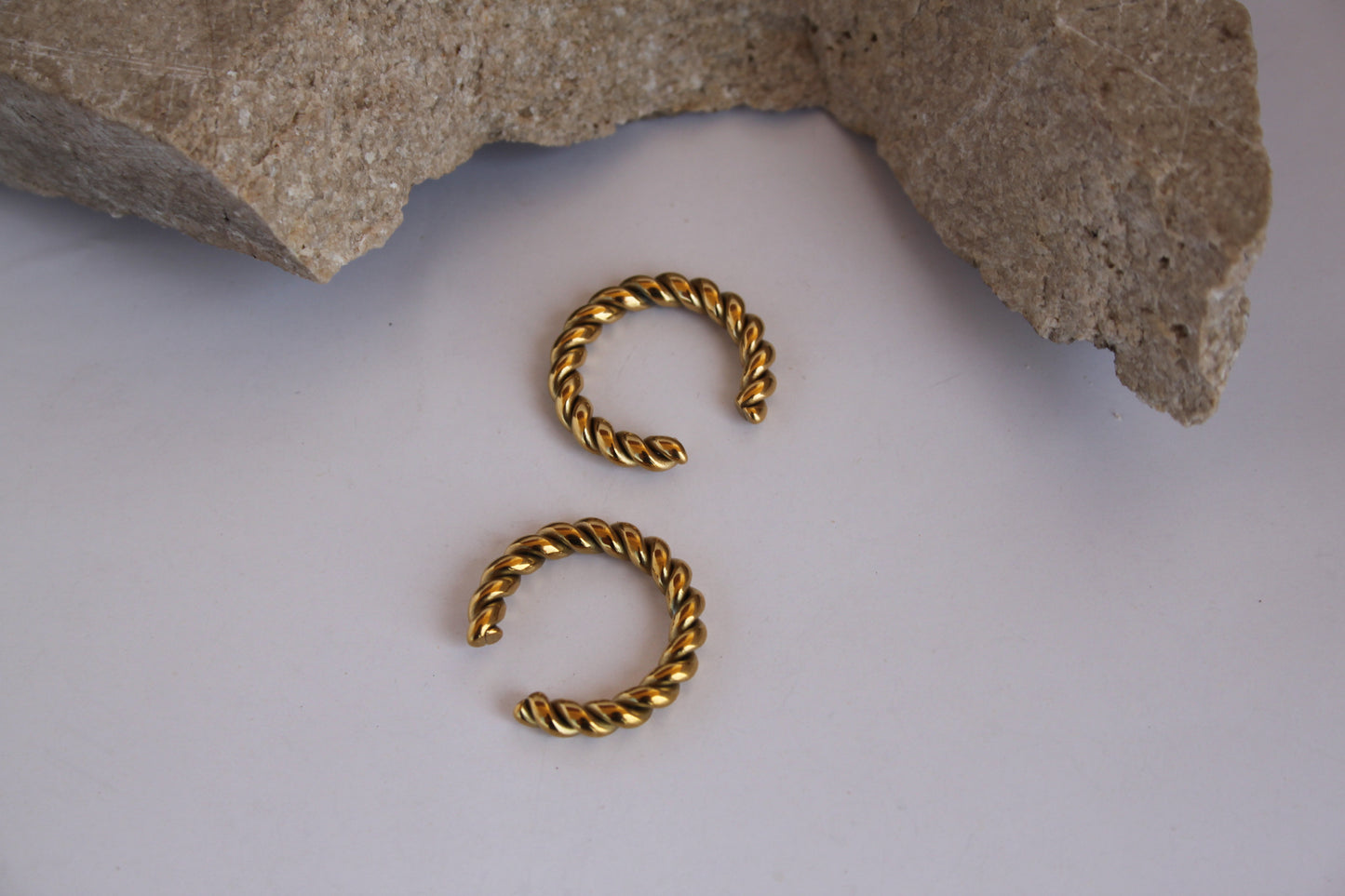 Twisted Ear CuffThe Coeur Earrings are a charming and romantic accessory that captures the essence of love and affection. These earrings feature a design inspired by the shape of a Stainless SteelTwisted Ear Cuff