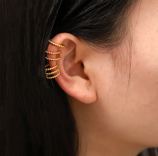 EnigmaEnigma Ear Cuff: Make a bold statement with our captivating Enigma Ear Cuff. This striking piece is designed to adorn your ear in an unconventional and mysterious waStainless SteelEnigma