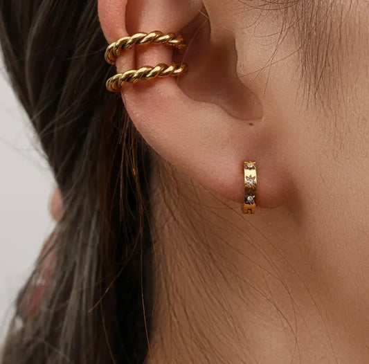 Twisted Ear CuffThe Coeur Earrings are a charming and romantic accessory that captures the essence of love and affection. These earrings feature a design inspired by the shape of a Stainless SteelTwisted Ear Cuff